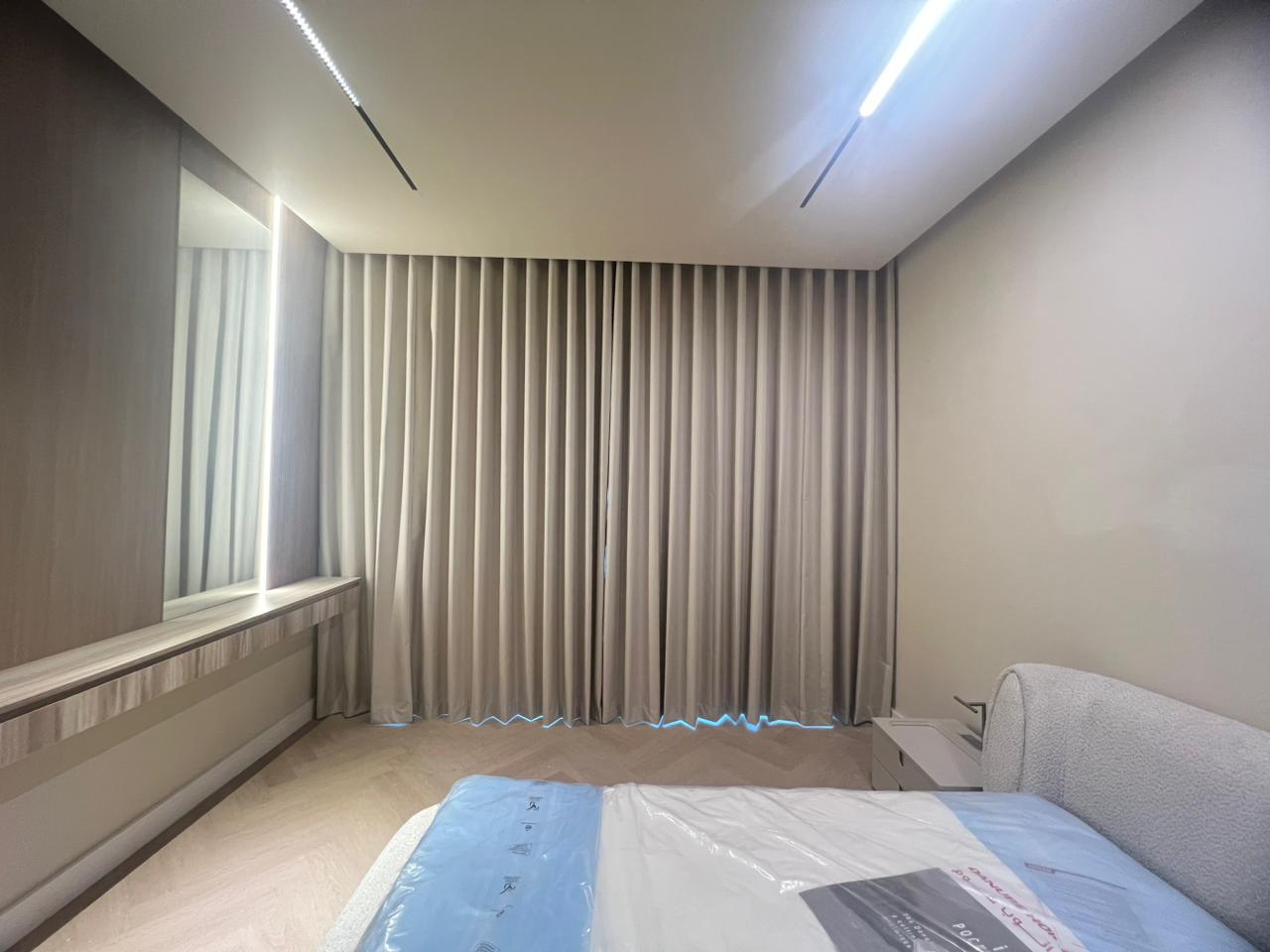 Luxury blackout roller blinds installed in a Dubai villa window with layered privacy bands