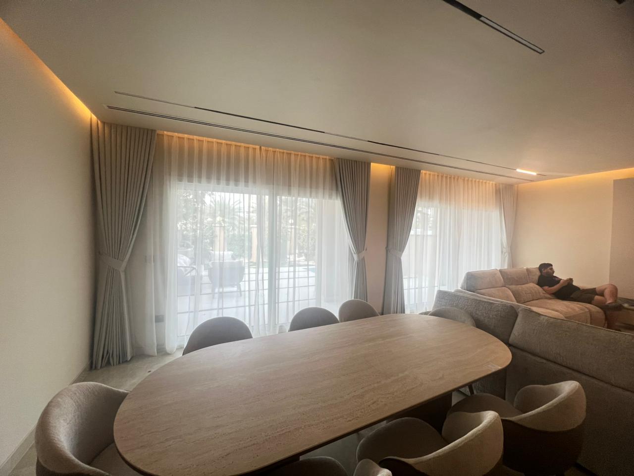 Custom blinds Sharjah installation with modern architectural roller fabric finish